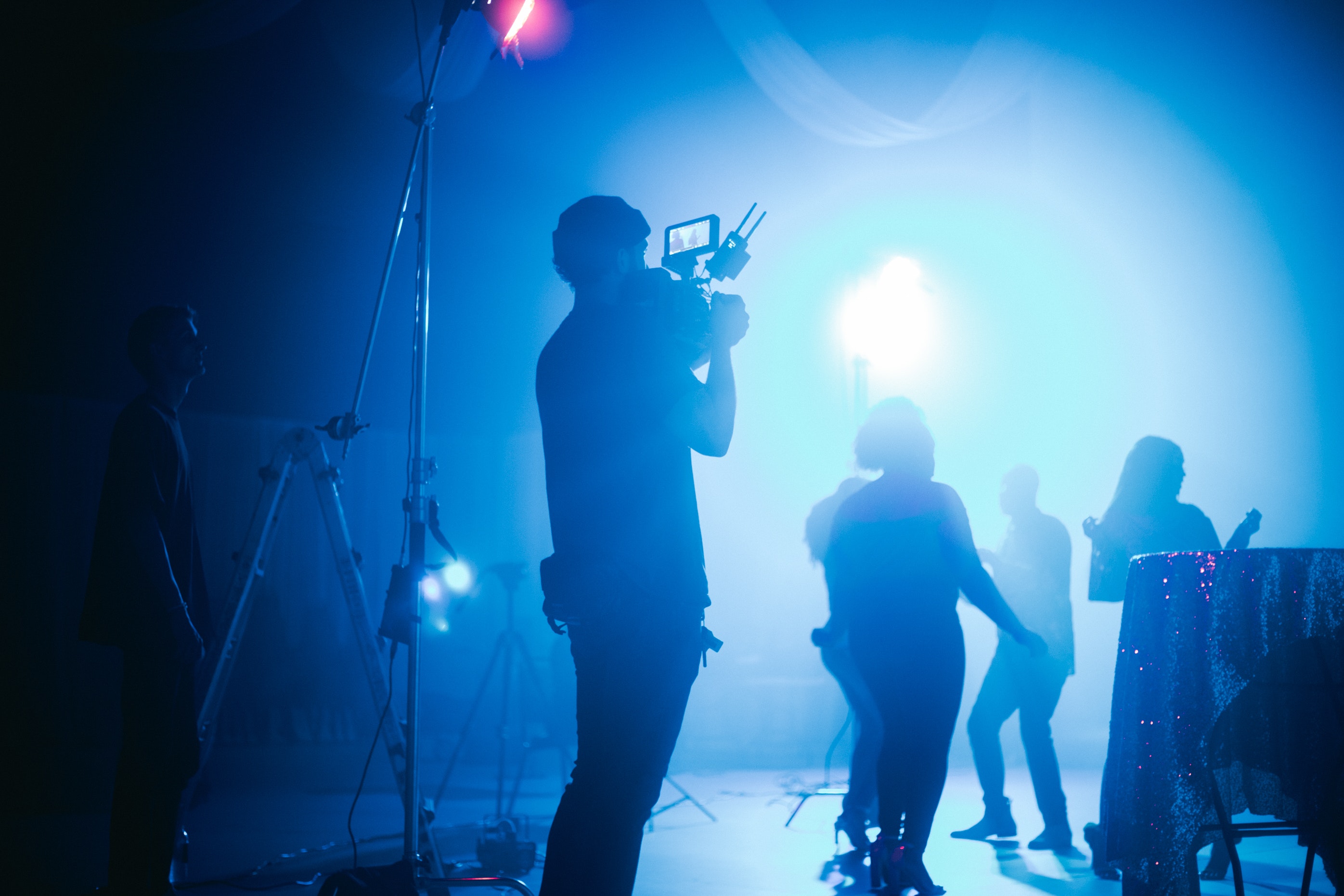 FogLine Media crew filming on a blue-lit set