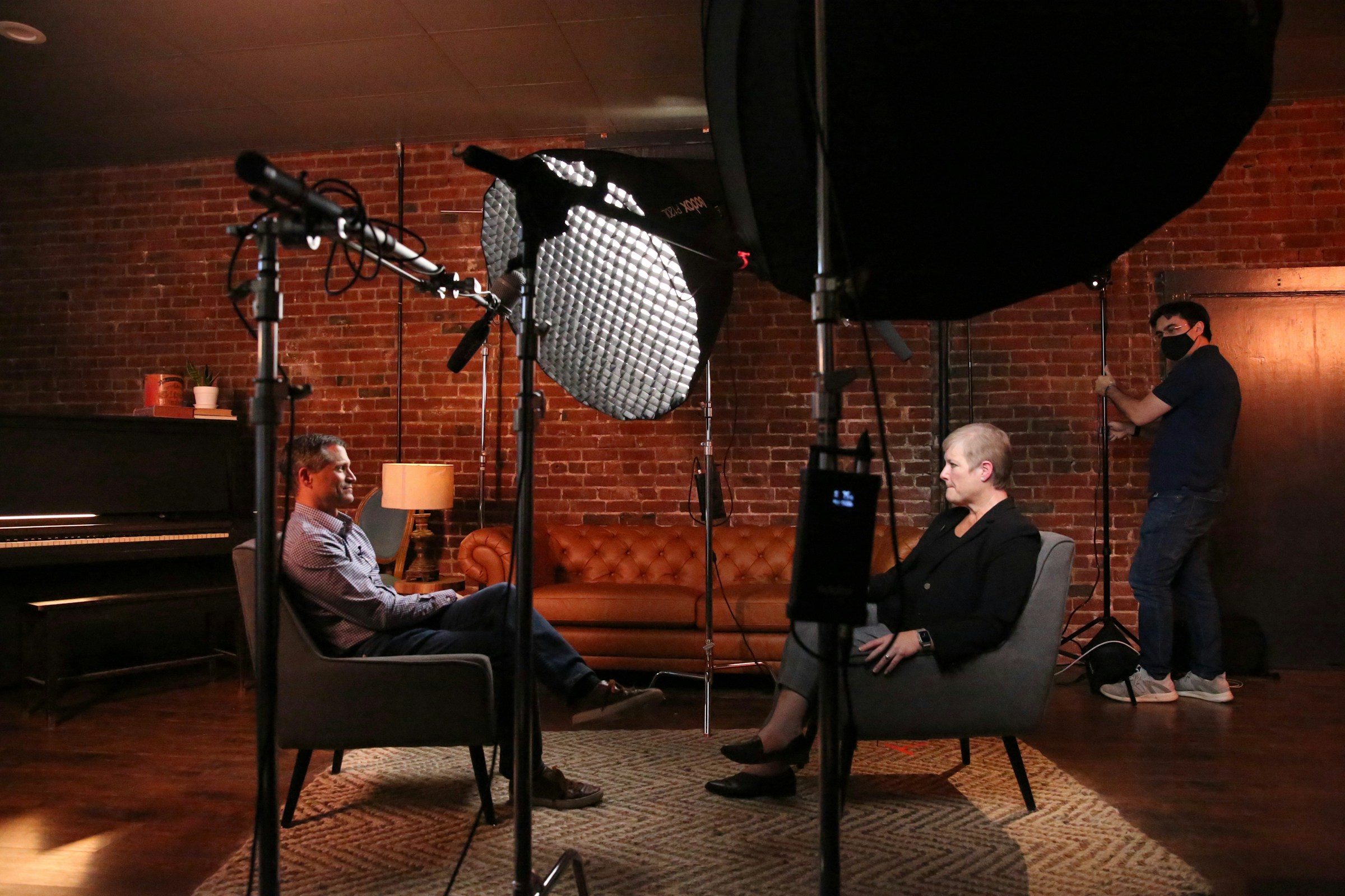 Interview set against a brick wall with a softbox
