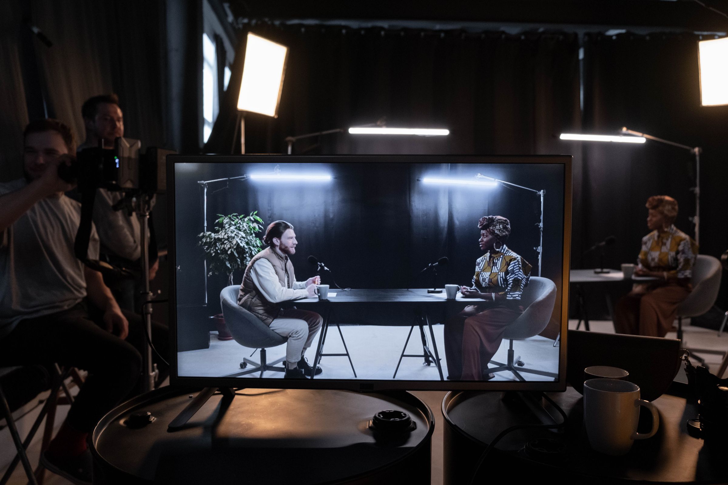 A podcast recording seen on the director's monitor