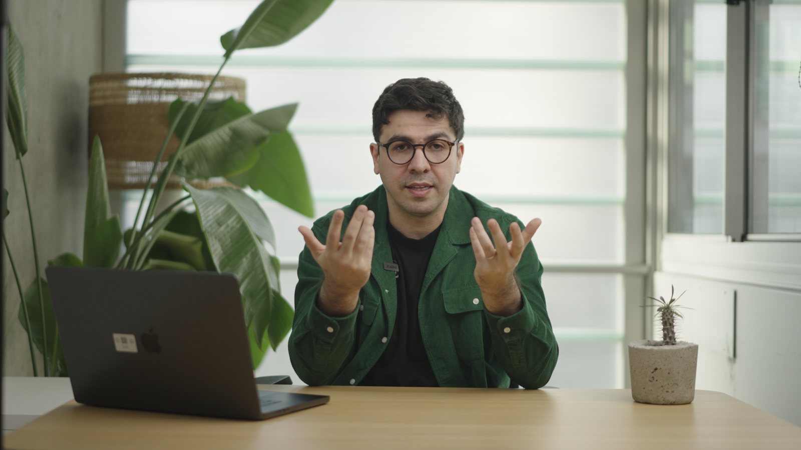 Artin Bogdanov, CEO of SUN, desk talk, front angle, filmed by FogLine Visuals at its SoMa studio in San Francisco